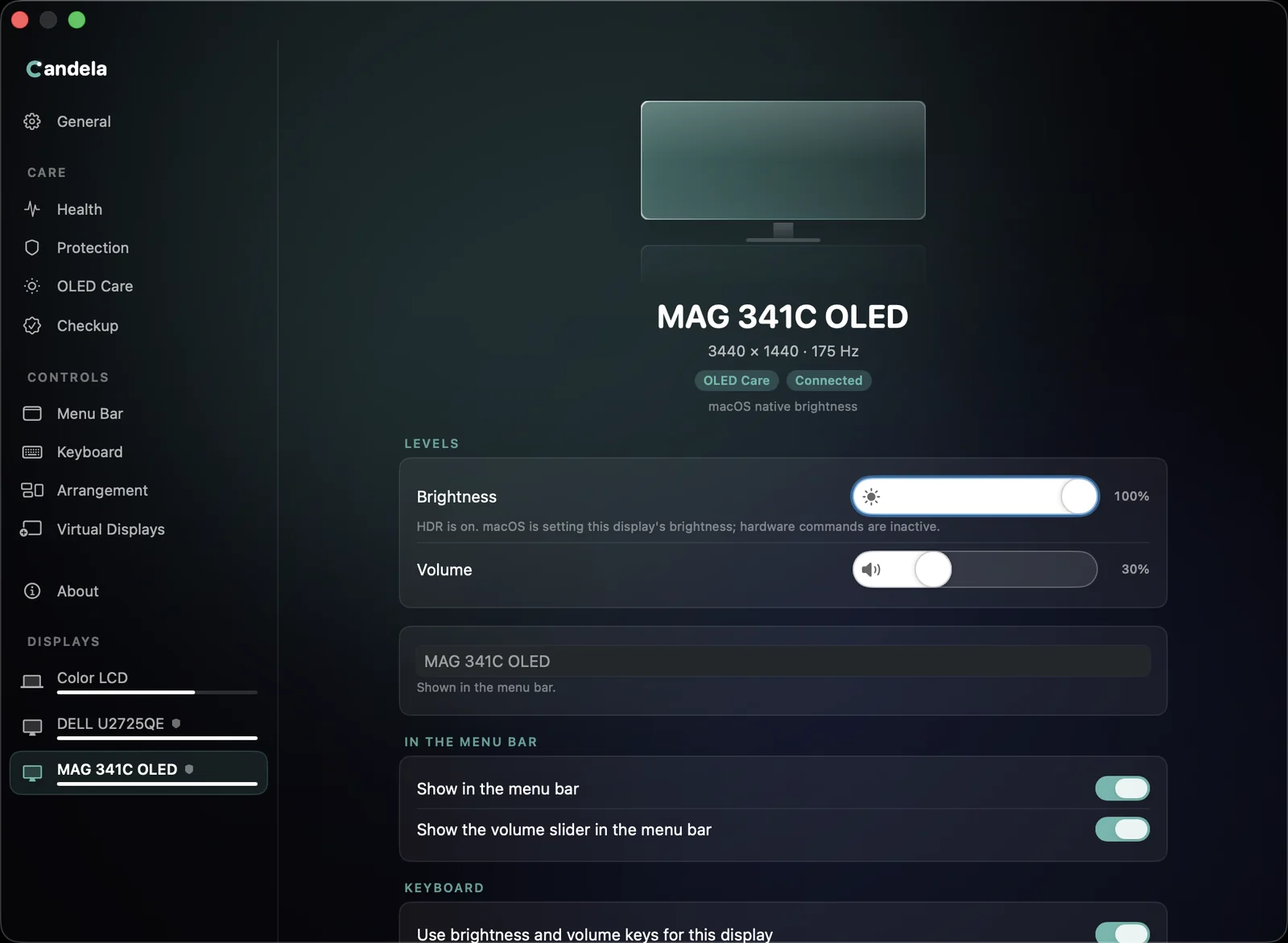 A display's settings page with the brightness slider at 100% and the note: HDR is on. macOS is setting this display's brightness; hardware commands are inactive.