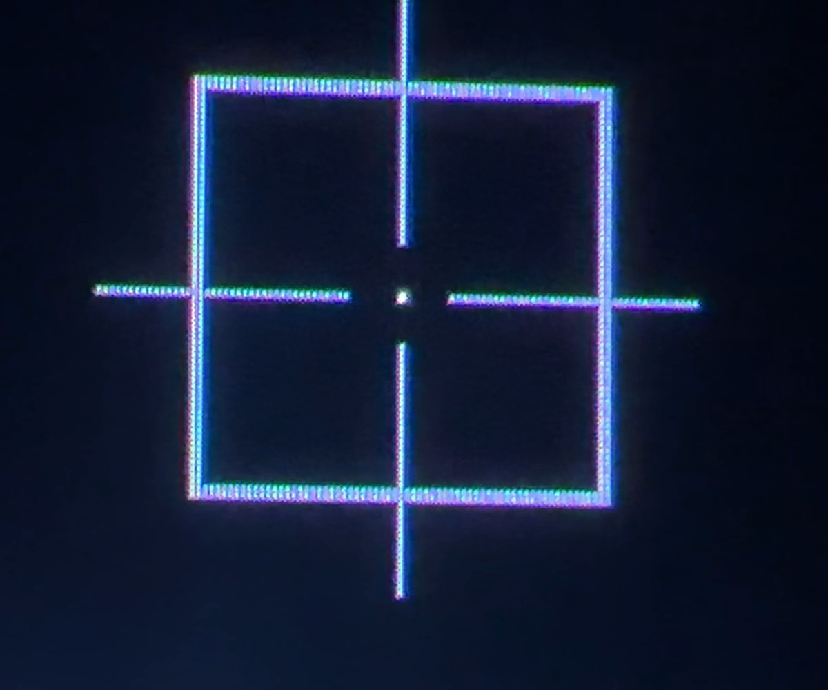 A camera crop shows the luminous calibration square, crosshair and single white test point against the dark panel.